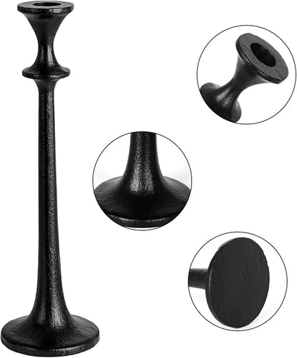 Black iron taper candle holder with flared top and round base, close-up details