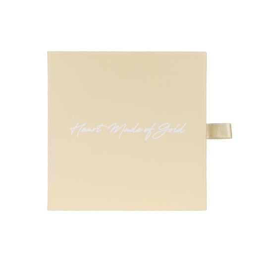 Beige gift box with ribbon, featuring cursive logo on the lid