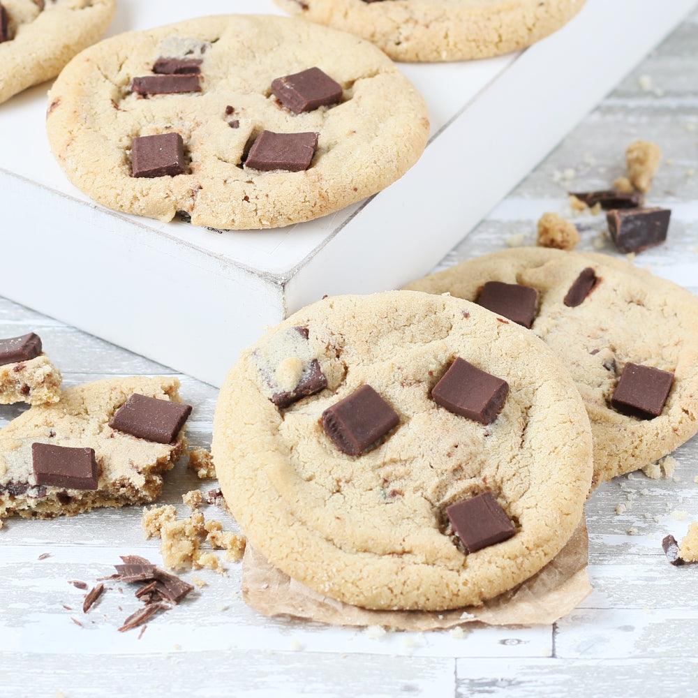 Chocolate chip cookies with chocolate chunks, close-up on white box liner