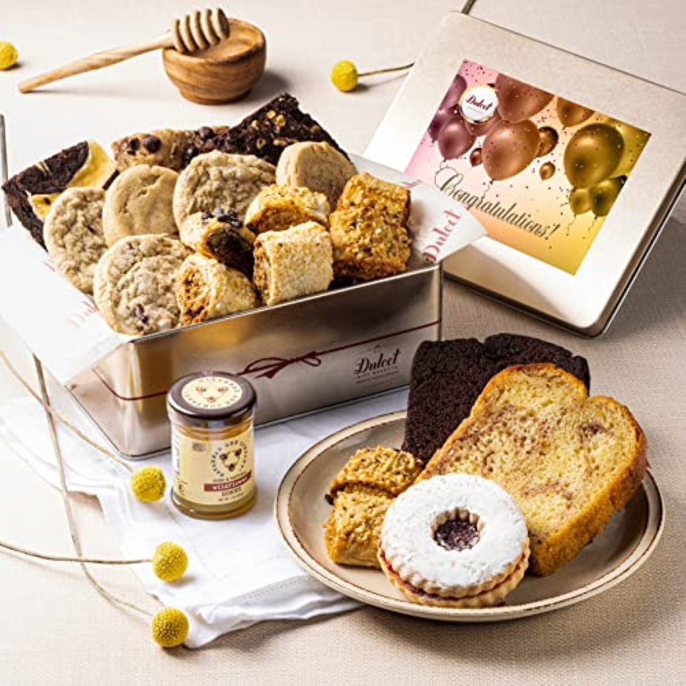 Deluxe honey pastry gift tin with cookies, cake slices, and golden-themed gift card