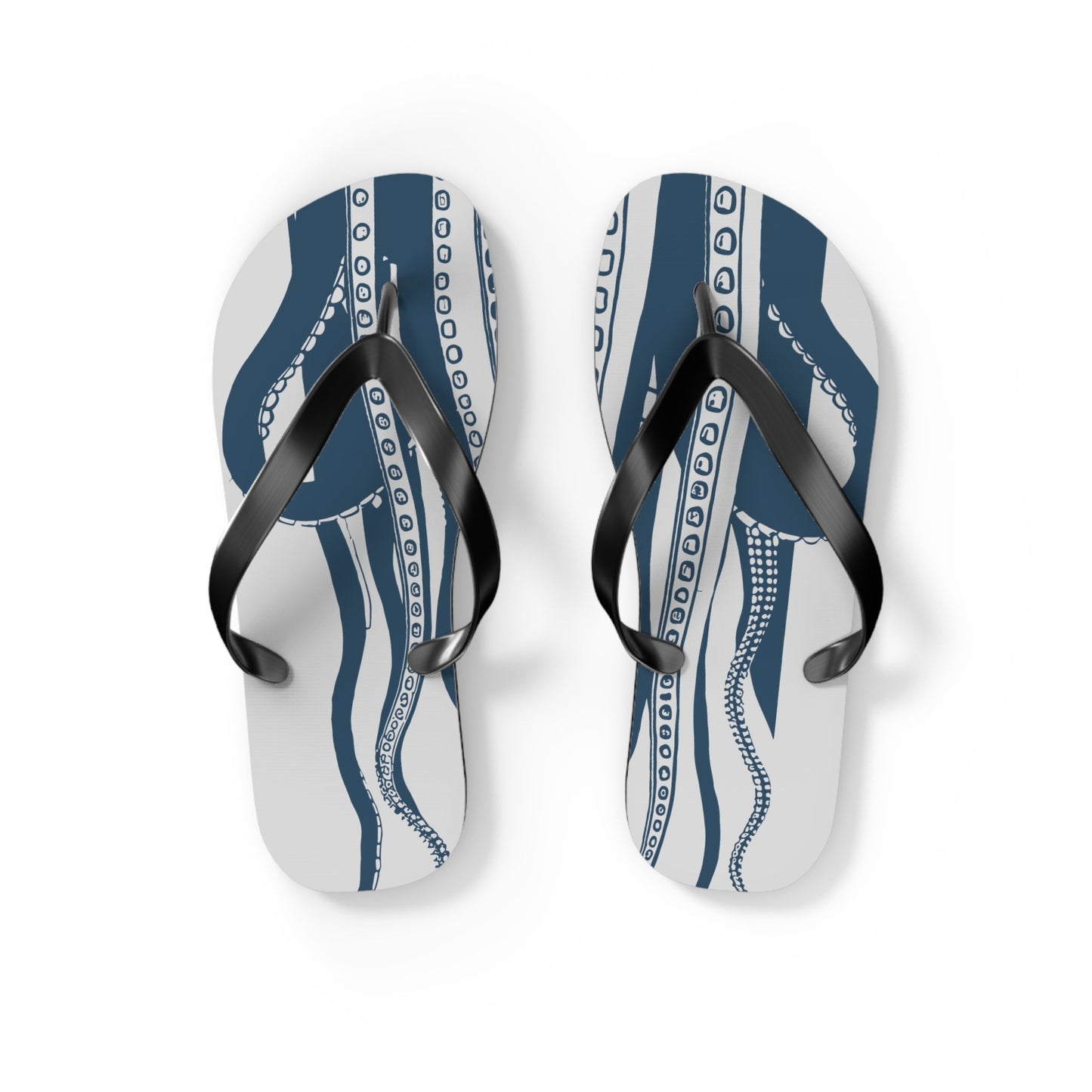 Pair of blue octopus-pattern flip-flops with black straps on light background