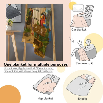 Kids flannel pirate treasure throw blanket with Jack design, displayed with travel icons
