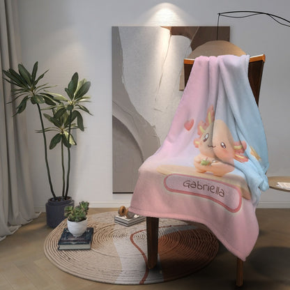 Pink and light-blue character blanket with bear holding drink and “Gabriella” graphic