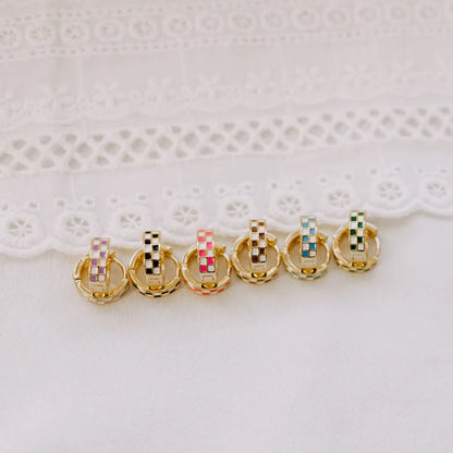 Six gold-filled huggie hoops with checkered inlays in assorted colors