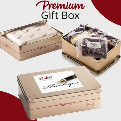 Premium gift tins with wrapped cookies and greeting card
