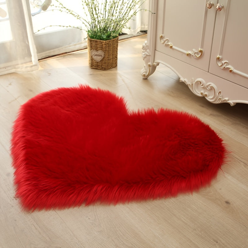 Heart-shaped faux fur rug with long shag pile, vivid red plush carpet mat.