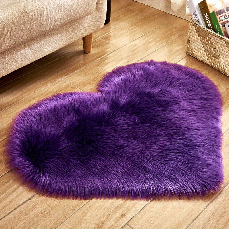 Purple heart-shaped faux fur rug with dense shaggy plush pile