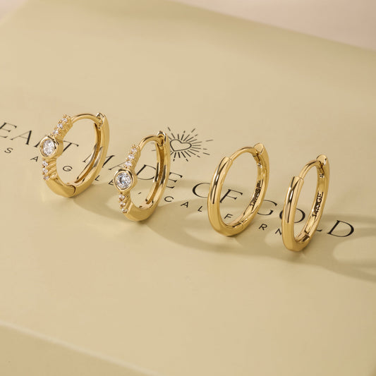 Gold-tone bezel hoop earrings with clear stones, set of multiple styles