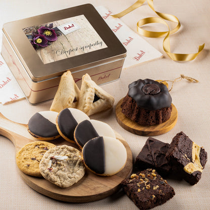 Cookie and brownie keepsake gift tin with sympathy card and assorted cookies on boards
