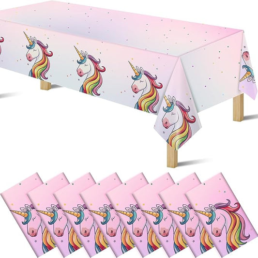 Unicorn pink plastic tablecloth with rainbow unicorn heads and star confetti, disposable