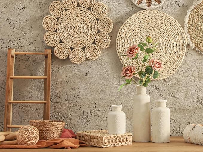 Set of 3 white ceramic vases with textured finish, displayed on a tabletop