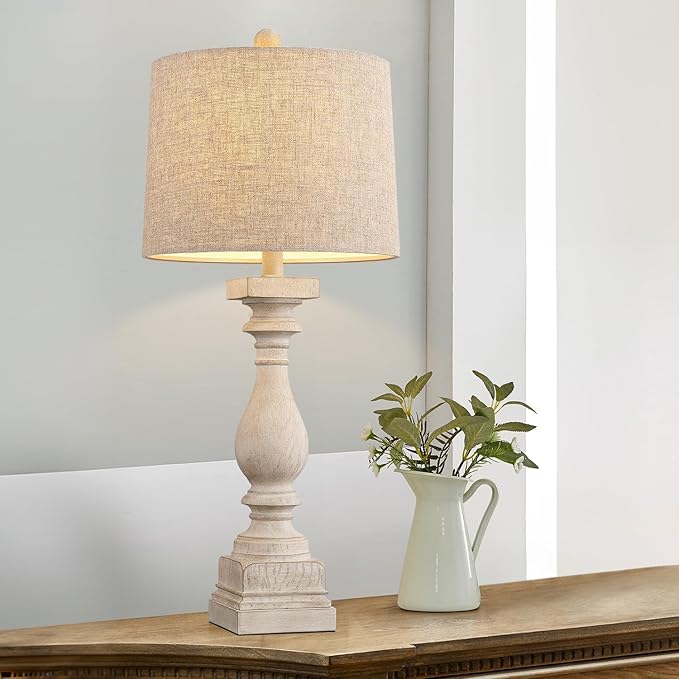 Farmhouse table lamp with beige fabric shade and textured resin pedestal base