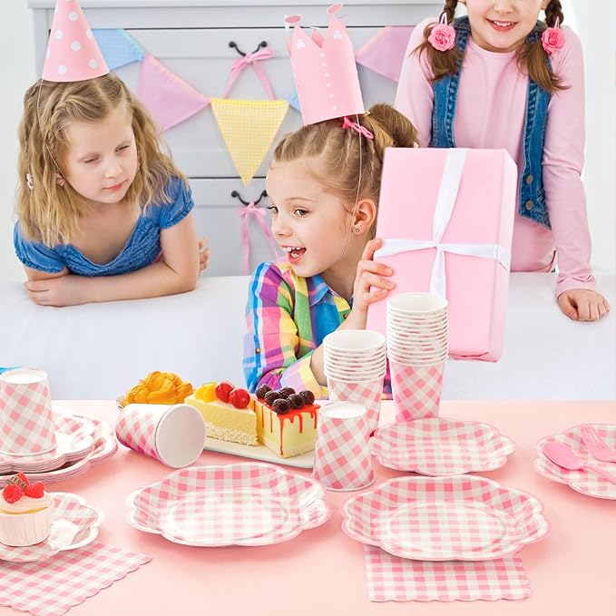 Pink gingham picnic tableware set on table with plates and cups for kids