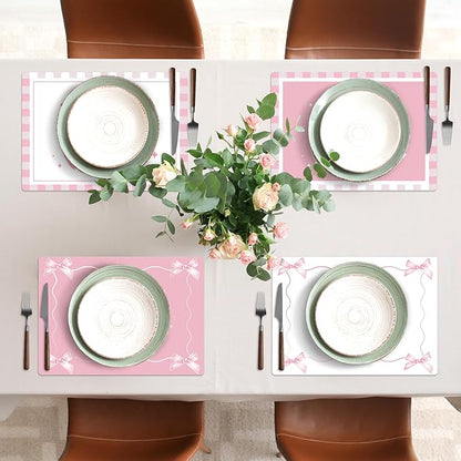 Pink plastic placemats with bow and star trim, table setting view