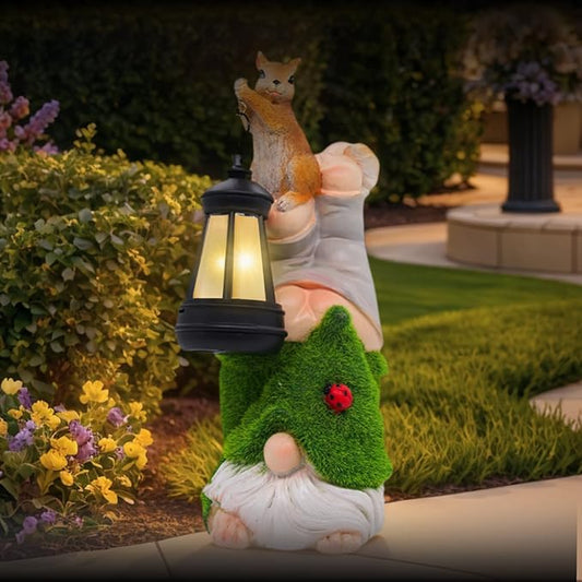 Outdoor garden gnome solar lantern statue, green tree suit with red ladybug
