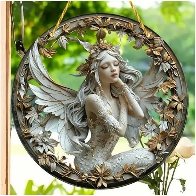 Hanging round ornament with a seated angel-winged fairy in a floral frame