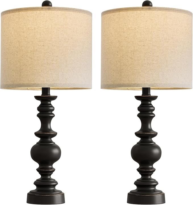 Pair of farmhouse table lamps with turned black resin bases and beige linen drum shades