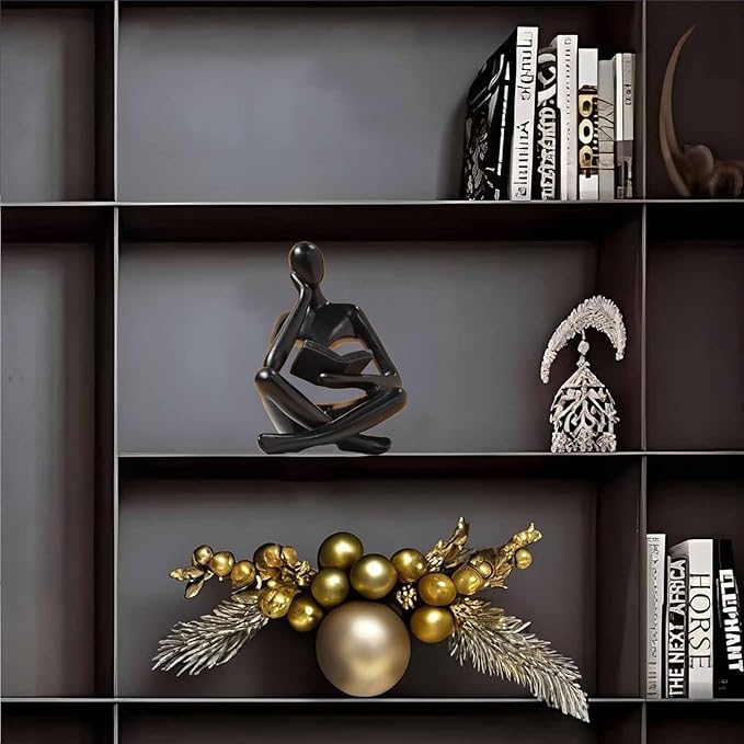 Zuo Si black resin reading thinker figurine on shelf, holding an open book