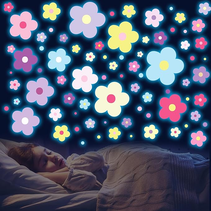 Glow-in-the-dark flower wall decals with multicolor 4-petal blossoms and small dotted accents