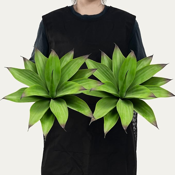 Two dark green faux agave plants with layered spiky leaves, shown side by side