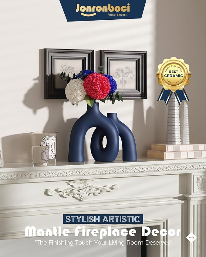 Matte navy ceramic mantle hug vase with conjoined donut opening cutouts.