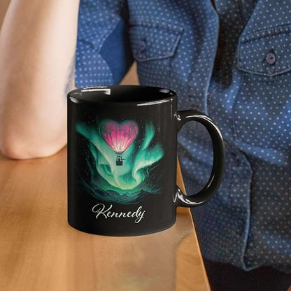 Black ceramic coffee mug with green aurora hot air balloon heart design and Kennedy