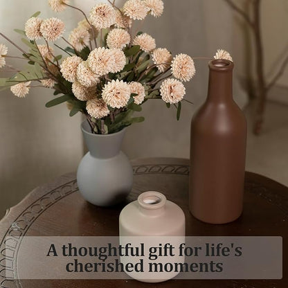 Ceramic vase set with faux chrysanthemum stems in light gray vase and brown vase