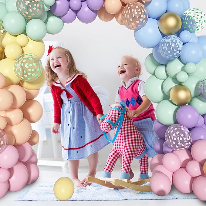Pastel balloon arch garland with gold confetti balloons framing an arched backdrop shape