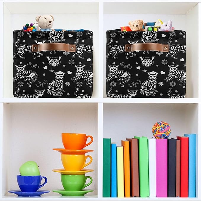 Two black cat-skeleton storage baskets with tan handle details on shelf cubbies