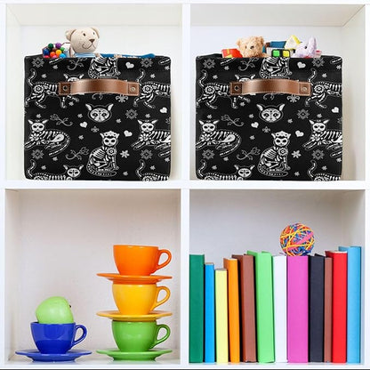 Two black cat-skeleton storage baskets with tan handle details on shelf cubbies