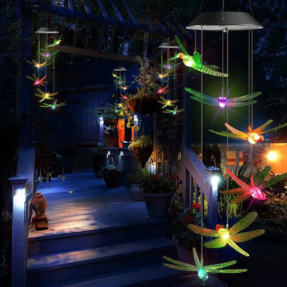Garden patio solar wind chimes with glowing dragonfly charms hanging from a metal lantern top