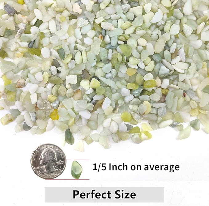Close-up of light green, white, and pale yellow polished stone pebbles