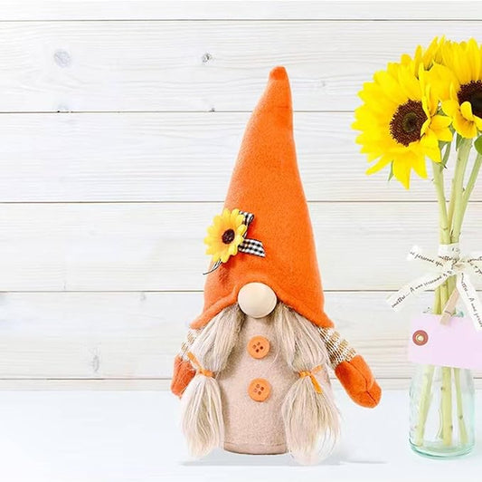 Orange plush gnome doll with white beard, yellow flower pin, and buttoned shirt.