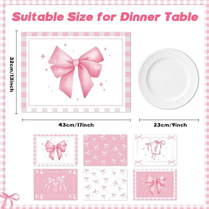 Pink plastic placemat set with ribbon bow design, shown with size guide