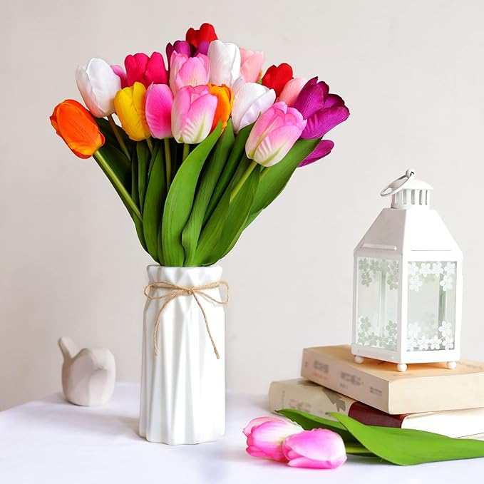 Artificial tulip bouquet with multicolor flower heads in a white vase tied with twine