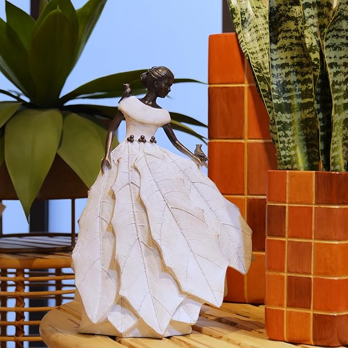 White resin fairy maiden statue angled view with layered dress and bird in hand