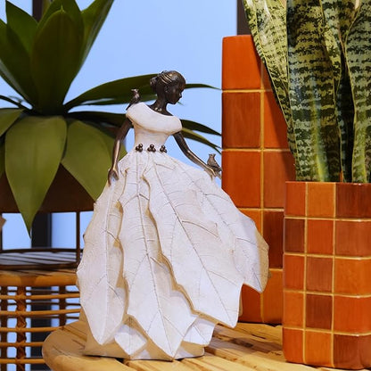 White resin fairy maiden statue angled view with layered dress and bird in hand