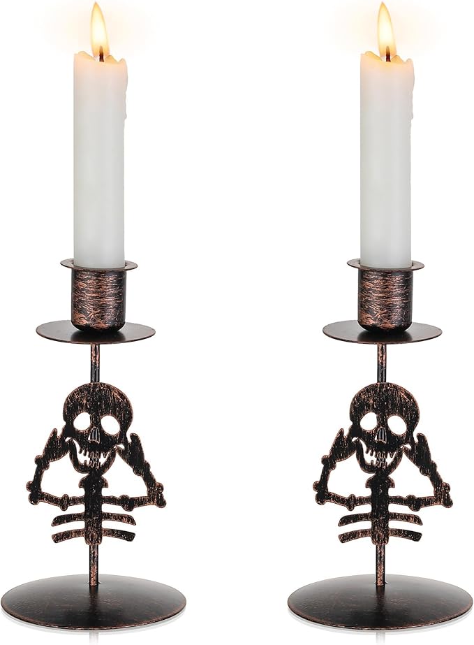 Pair of black gothic skull taper candle holders with metal cups
