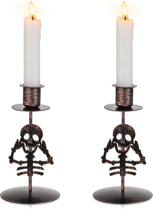 Pair of black gothic skull taper candle holders with metal cups
