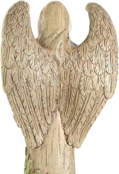 Back of the resin angel statue showing sculpted feathered wings and long hair.