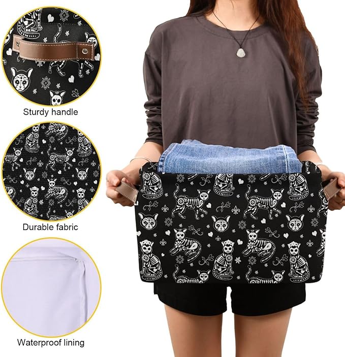 Black cat-skeleton storage basket with tan handles and visible waterproof lining edge