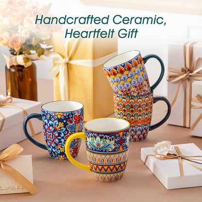 Handcrafted ceramic gift set of boho coffee mugs with handles, colorful patterns on display