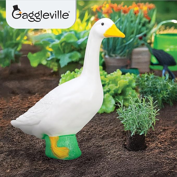 White goose statue with molded feather details and a green base