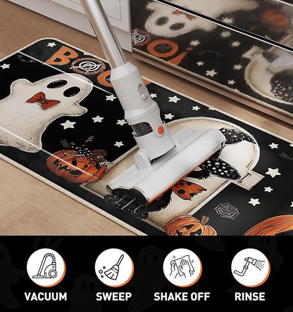 Black Halloween kitchen rug with ghost and jack-o'-lantern pattern, vacuum cleaning