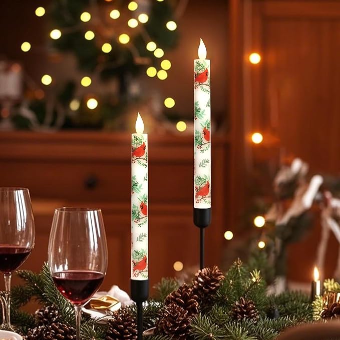 LED taper candles, white with red cardinal and green leaf print, glowing warm flame LEDs.