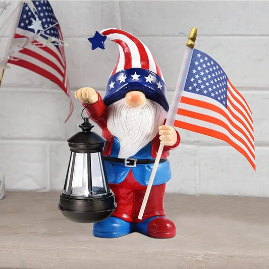 Patriotic solar gnome statue holding American flag and lantern light