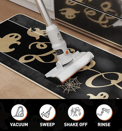 Black Halloween kitchen rug with gold ghost and spider web pattern, vacuumed