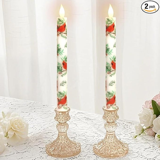 Pair of LED taper candles, white with red cardinal and green leaf print, faux gold bases.