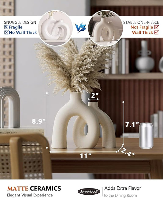 Matte cream ceramic conjoined vase set with circular cutouts, tall arched silhouette