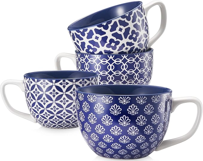 Set of 4 blue ceramic coffee mugs with handles and white geometric patterns.